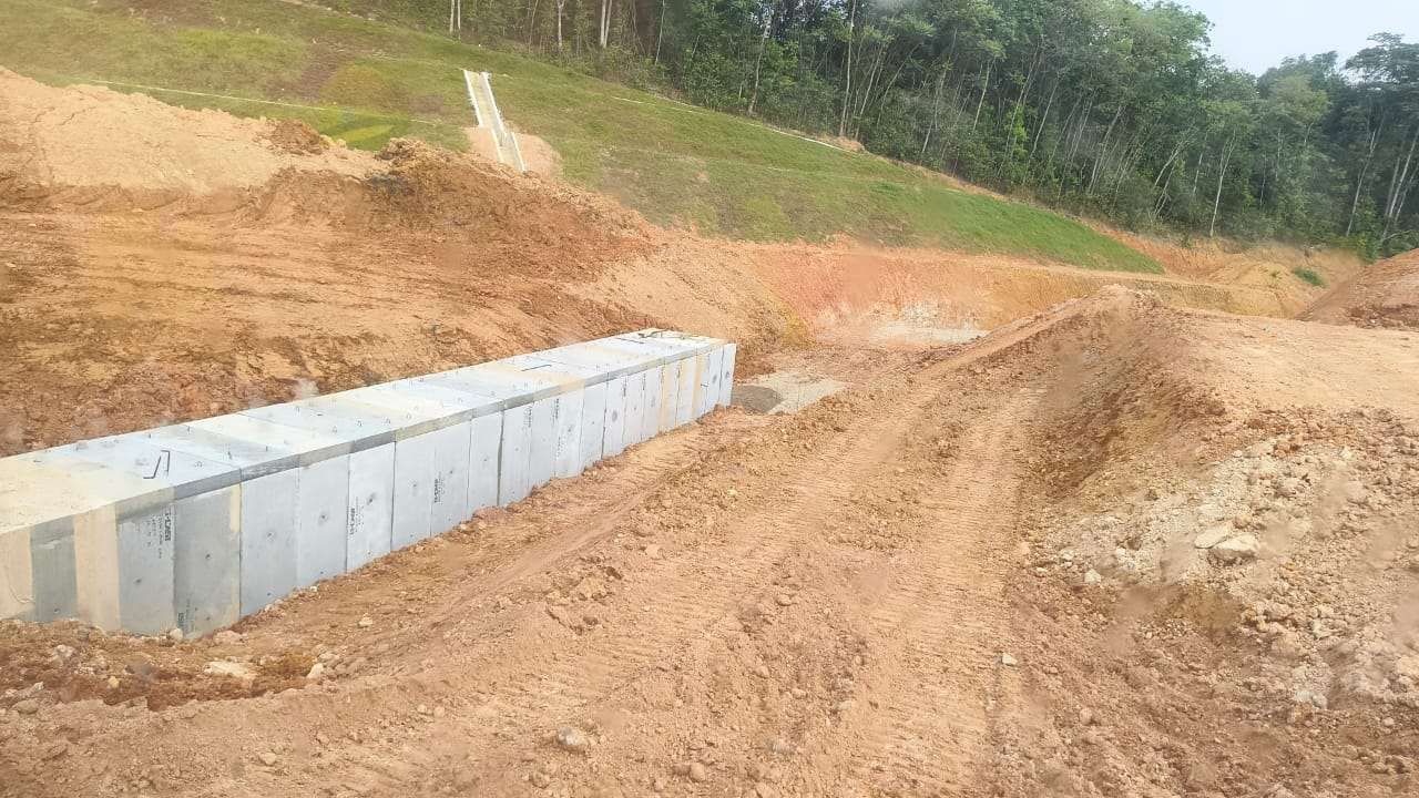 Reinforced concrete box culvert and access road under construction