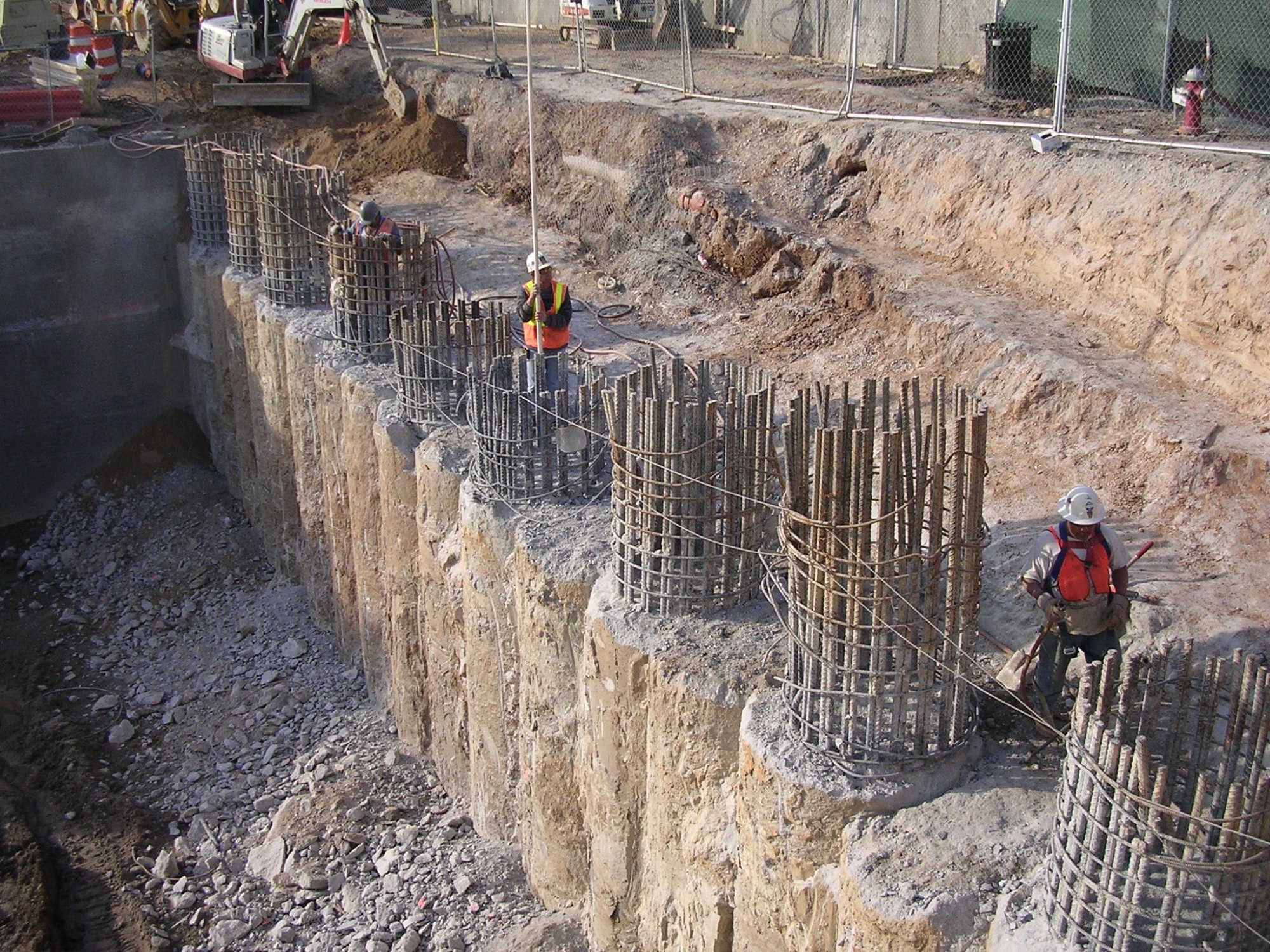 Reinforced rebar cages for bored piles in a deep excavation